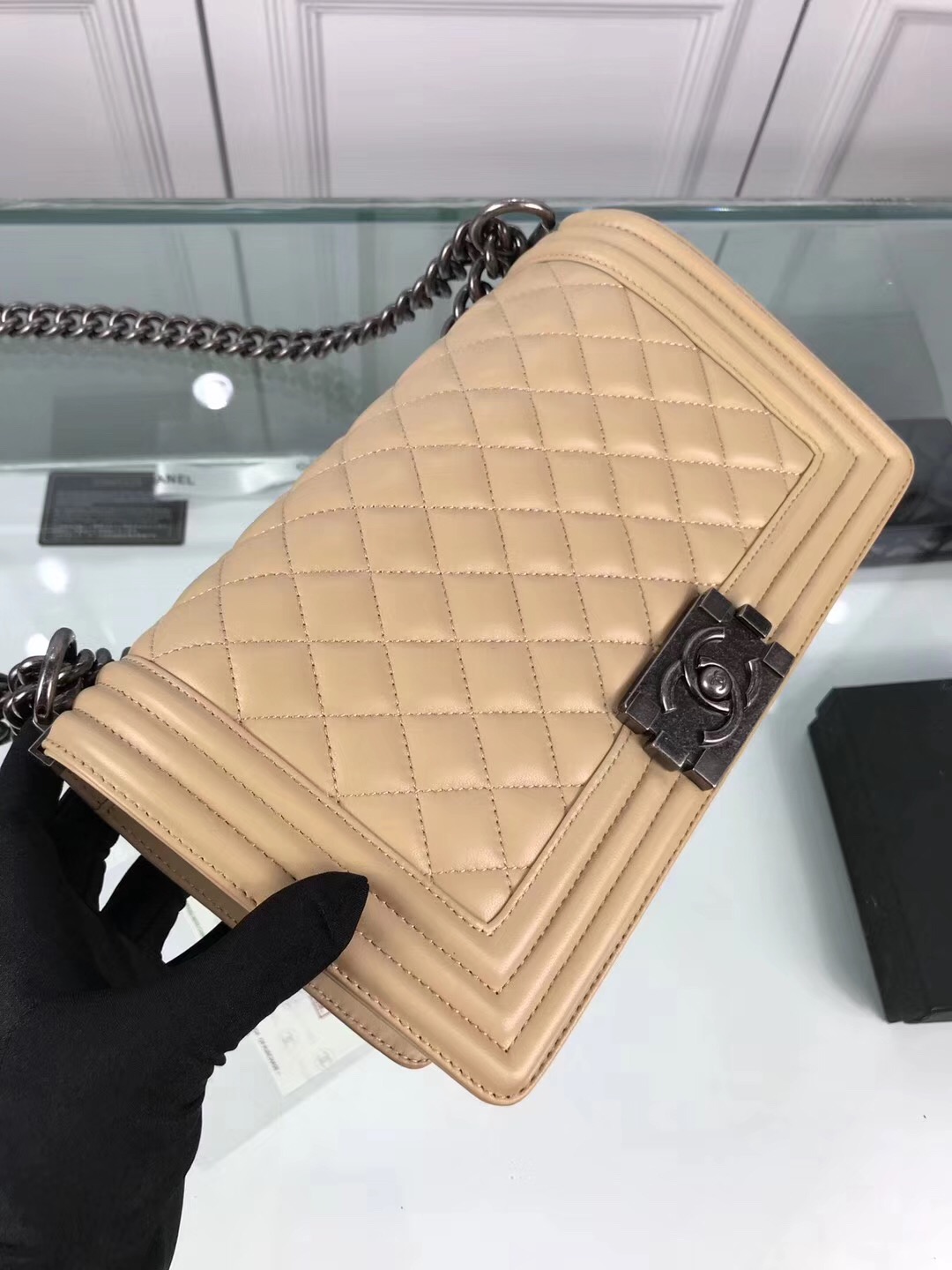 CHANEL 'Boy' Diamond Quilted Leather Flap Bag. Original Quality Bag including gift box, care book, dust bag, authenticity card. Created by Karl Lagerfeld, the iconic design owes its name to Gabrielle Chanel's first love, Boy Capel. This Chanel Boy Flap Bag Quilted is every woman's dream. Crafted from calfskin leather, the bag features Chanel's signature diamond quilting, chunky chain link strap with leather shoulder pad, and metal-tone hardware accents. Its CC Boy logo closure opens to a fabric-lined interior with slip pocket perfect for daily essentials. A sought-after, luxurious accessory.