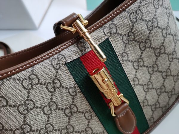 GUCCI Jackie O 1961 Small Hobo Bag. Original Quality Bag including gift box, care book, dust bag, authenticity card. The reintroduction of the Jackie 1961 bag presents a new take on a historical Gucci icon. First created in 1961, the bag was often photographed with Jackie Kennedy and it soon became known as “The Jackie." Brought back to the forefront, the recognizable shape is presented in GG Supreme canvas and enhanced with an additional, detachable shoulder strap. Attached to the bag with buckle closure, the second strap adds a contemporary feel to the archival style, providing new ways to wear—top handle, shoulder, or crossbody. Pieces with versatile ways to wear and style embrace each person who is part of the House’s individual spirit. I Cris and Coco High-End Bags and Luxury Accessories