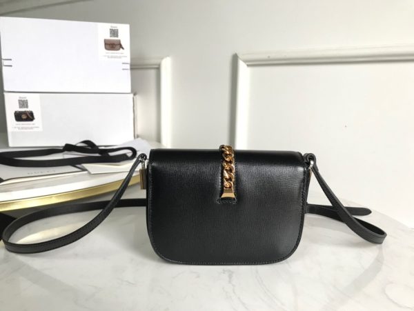 GUCCI Sylvie 1969 Mini Shoulder Bag. Original Quality Bag including gift box, care book, dust bag, authenticity card. Introduced in a mini size for Pre-Fall 2020, the Sylvie 1969 shoulder bag is designed with its original archetype in mind, unifying the details of its archival inspiration with a contemporary spirit. The shoulder bag in textured leather is defined by a narrow gold-toned metal chain fitted to the flap. The softly rounded silhouette is completed with an adjustable strap that can be worn on one shoulder or cross body.