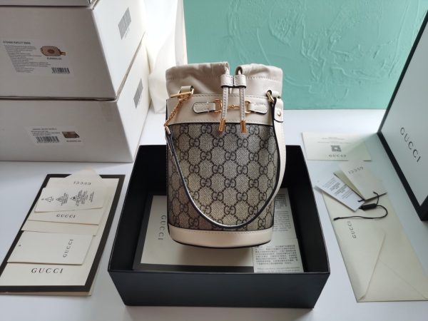 GUCCI 1995 Horsebit Leather Bucket Bag. Original Quality Bag including gift box, care book, dust bag, authenticity card. A new shape introduced within the Gucci Horsebit 1955 line presents a semi-rigid rounded bag design with a deconstructed drawstring closure on top. Inspired by an archival design, the accessory unifies the original details with a modern spirit, highlighting the Horsebit. Part of Gucci’s genetic code, the double ring, and bar design has been established as one of the most distinctive elements among the House symbols borrowed from the equestrian world.