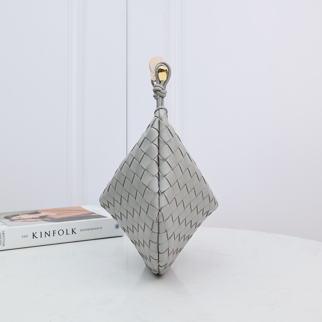 BOTTEGA VENETA Mini Sardine. Crafted to Perfection, Inspired by Nature: Your Timeless Companion for All Occasions. Bottega Veneta's masterful intrecciato weaving technique was originally crafted to ensure the enduring quality of leather goods. The Sardine Mini leather shoulder bag, meticulously fashioned from supple lamb leather, showcases a distinctive top handle reminiscent of a graceful fish. This versatile piece seamlessly transitions from day to night, making it the perfect, reliable companion to elegantly accommodate all your essentials.