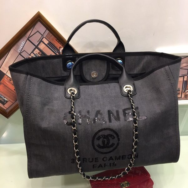 New Small CHANEL Deauville Tote. Authentic Quality Bag with literature, dust bag, gift box and authenticity card, payment slip. This is an original quality CHANEL Denim Canvas Small Deauville Tote. This lovely and best-selling tote is crafted in fine denim canvas printed with a CHANEL stitched logo. The bag features metal threaded chain shoulder straps with leather shoulder pads, canvas trim, and an open top. The bag opens to a spacious fabric interior with zipper and patch pockets. Enjoy this timeless style for everyday needs and shopping.