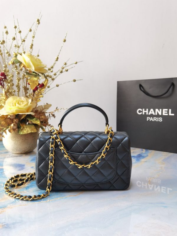 CHANEL 20 New Classic Mini Flap Bag With Handle. Original Quality Bag including gift box, care book, dust bag, authenticity card. This chic petite shoulder bag is crafted of luxurious shimmery lambskin leather. The crossbody bag features a long adjustable chain-link leather threaded shoulder strap and front flap with a CC turn lock. The flap opens to an interior of matching leather with zipper and patch pockets. Enjoy this fabulous bag for everyday essentials or special events.