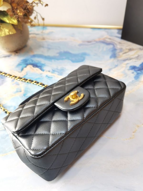 CHANEL 20 New Classic Mini Flap Bag With Handle. Original Quality Bag including gift box, care book, dust bag, authenticity card. This chic petite shoulder bag is crafted of luxurious shimmery lambskin leather. The crossbody bag features a long adjustable chain-link leather threaded shoulder strap and front flap with a CC turn lock. The flap opens to an interior of matching leather with zipper and patch pockets. Enjoy this fabulous bag for everyday essentials or special events.