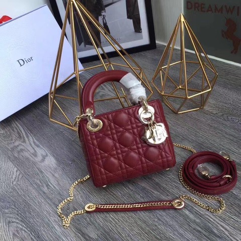 DIOR Mini ‘Lady DIOR’ Bag. Original Quality Bag including gift box, care book, dust bag, authenticity card. This Mini bag epitomizes Dior's vision of elegance and beauty. Sleek and refined, the timeless yet relevant style is crafted in calfskin/lambskin with Cannage stitching, creating the instantly recognizable quilted texture. The metal 'D.I.O.R.' charms further embellish the silhouette. Featuring a removable chain shoulder strap, this bag is the ideal evening companion.