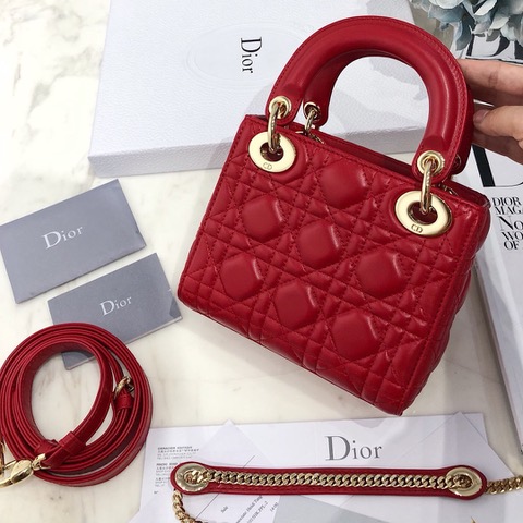 DIOR Mini ‘Lady DIOR’ Bag. Original Quality Bag including gift box, care book, dust bag, authenticity card. This Mini bag epitomizes Dior's vision of elegance and beauty. Sleek and refined, the timeless yet relevant style is crafted in calfskin/lambskin with Cannage stitching, creating the instantly recognizable quilted texture. The metal 'D.I.O.R.' charms further embellish the silhouette. Featuring a removable chain shoulder strap, this bag is the ideal evening companion.
