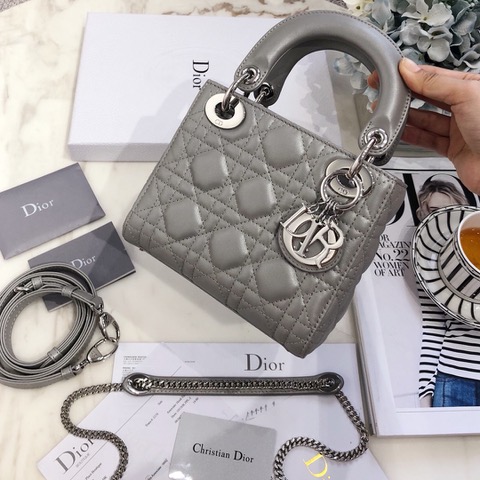DIOR Mini ‘Lady DIOR’ Bag. Original Quality Bag including gift box, care book, dust bag, authenticity card. This Mini bag epitomizes Dior's vision of elegance and beauty. Sleek and refined, the timeless yet relevant style is crafted in calfskin/lambskin with Cannage stitching, creating the instantly recognizable quilted texture. The metal 'D.I.O.R.' charms further embellish the silhouette. Featuring a removable chain shoulder strap, this bag is the ideal evening companion.