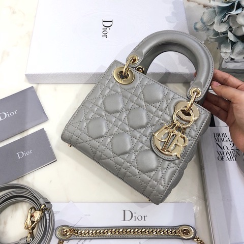 DIOR Mini ‘Lady DIOR’ Bag. Original Quality Bag including gift box, care book, dust bag, authenticity card. This Mini bag epitomizes Dior's vision of elegance and beauty. Sleek and refined, the timeless yet relevant style is crafted in calfskin/lambskin with Cannage stitching, creating the instantly recognizable quilted texture. The metal 'D.I.O.R.' charms further embellish the silhouette. Featuring a removable chain shoulder strap, this bag is the ideal evening companion.