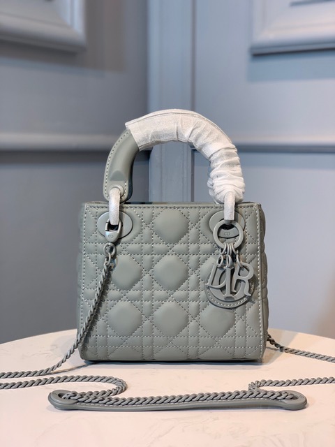 DIOR Mini ‘Lady DIOR’ Bag. Original Quality Bag including gift box, care book, dust bag, authenticity card. This Mini bag epitomizes Dior's vision of elegance and beauty. Sleek and refined, the timeless yet relevant style is crafted in calfskin/lambskin with Cannage stitching, creating the instantly recognizable quilted texture. The metal 'D.I.O.R.' charms further embellish the silhouette. Featuring a removable chain shoulder strap, this bag is the ideal evening companion.