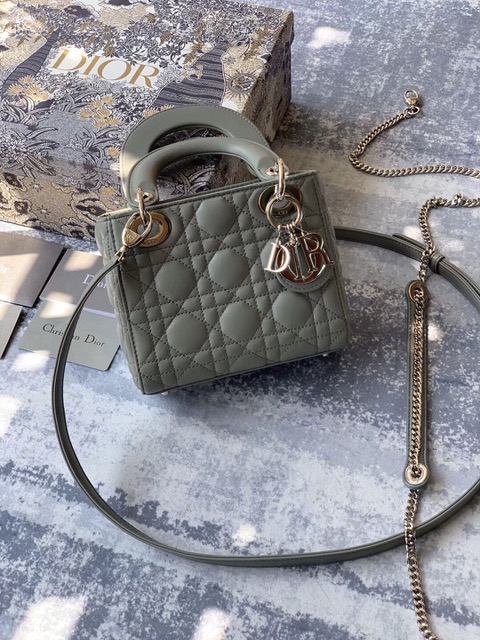 DIOR Mini ‘Lady DIOR’ Bag. Original Quality Bag including gift box, care book, dust bag, authenticity card. This Mini bag epitomizes Dior's vision of elegance and beauty. Sleek and refined, the timeless yet relevant style is crafted in calfskin/lambskin with Cannage stitching, creating the instantly recognizable quilted texture. The metal 'D.I.O.R.' charms further embellish the silhouette. Featuring a removable chain shoulder strap, this bag is the ideal evening companion.