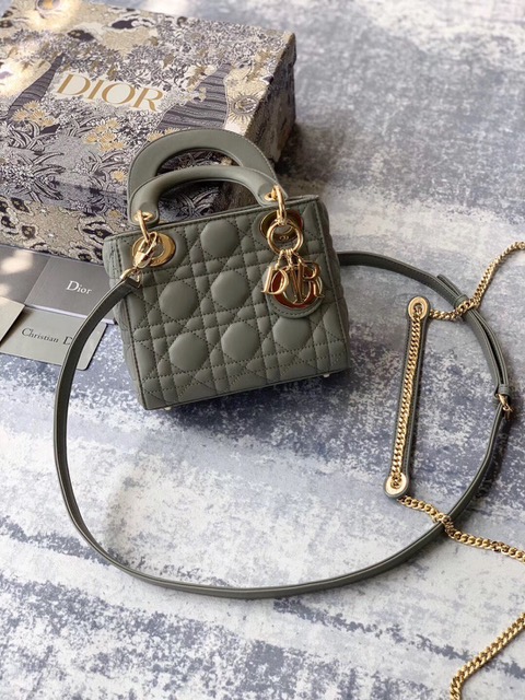 DIOR Mini ‘Lady DIOR’ Bag. Original Quality Bag including gift box, care book, dust bag, authenticity card. This Mini bag epitomizes Dior's vision of elegance and beauty. Sleek and refined, the timeless yet relevant style is crafted in calfskin/lambskin with Cannage stitching, creating the instantly recognizable quilted texture. The metal 'D.I.O.R.' charms further embellish the silhouette. Featuring a removable chain shoulder strap, this bag is the ideal evening companion.
