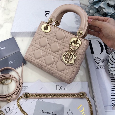 DIOR Mini ‘Lady DIOR’ Bag. Original Quality Bag including gift box, care book, dust bag, authenticity card. This Mini bag epitomizes Dior's vision of elegance and beauty. Sleek and refined, the timeless yet relevant style is crafted in calfskin/lambskin with Cannage stitching, creating the instantly recognizable quilted texture. The metal 'D.I.O.R.' charms further embellish the silhouette. Featuring a removable chain shoulder strap, this bag is the ideal evening companion.