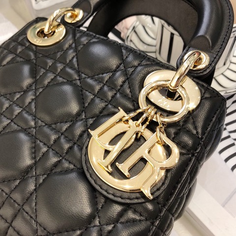 DIOR Mini ‘Lady DIOR’ Bag. Original Quality Bag including gift box, care book, dust bag, authenticity card. This Mini bag epitomizes Dior's vision of elegance and beauty. Sleek and refined, the timeless yet relevant style is crafted in calfskin/lambskin with Cannage stitching, creating the instantly recognizable quilted texture. The metal 'D.I.O.R.' charms further embellish the silhouette. Featuring a removable chain shoulder strap, this bag is the ideal evening companion.