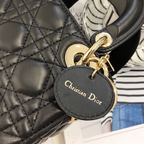 DIOR Mini ‘Lady DIOR’ Bag. Original Quality Bag including gift box, care book, dust bag, authenticity card. This Mini bag epitomizes Dior's vision of elegance and beauty. Sleek and refined, the timeless yet relevant style is crafted in calfskin/lambskin with Cannage stitching, creating the instantly recognizable quilted texture. The metal 'D.I.O.R.' charms further embellish the silhouette. Featuring a removable chain shoulder strap, this bag is the ideal evening companion.