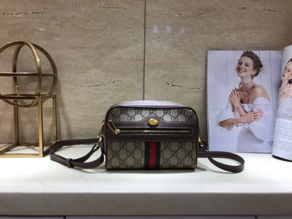 GUCCI Ophidia Small GG Supreme Camera Crossbody Bag. Original Quality Bag. Authentic Style. Authentic Packaging. Original Quality Dust Bag. Gucci camera crossbody bag in GG Supreme canvas, a material with low environmental impact. Leather trim with signature web accents. Adjustable shoulder strap, 65.0cm drop. Zip top closure. Exterior, front zip pocket. Interior, one zip pocket. One slip pocket. Founded in Florence in 1921, Gucci is one of the world's leading luxury fashion brands, with a renowned reputation for creativity, innovation and exceptional craftsmanship.