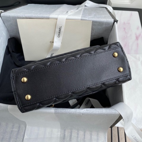 CHANEL Flap Bag with Coco Handle. Original Quality Bag including gift box, care book, dust bag, authenticity card. Despite the similarities to the Chanel Flap Bag, the Coco Handle stands apart from this and other popular Chanel models. And is perhaps the main reason behind it being unofficially renamed as the ‘Coco Handle’! The top ‘handle’ is its most distinctive feature. Structured and comfortably sized, it stands tall even when put down. The handle, combined with the trapezoid shape, bestows a modern touch to an otherwise classic style. Depending on the size you choose, the bag can find function as a day, an evening, or a day-to-night bag.