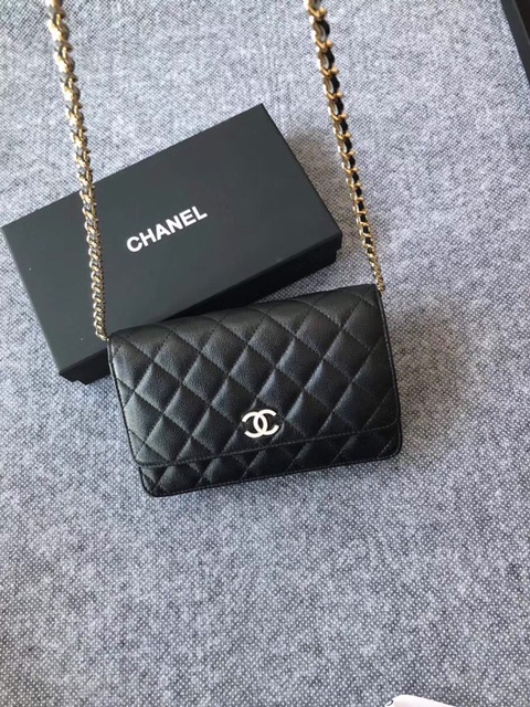CHANEL Classic Wallet on Chain. Authentic Quality Wallet, including gift box, literature, dust bag, authenticity card. Classic and elegant, a Chanel bag is a fashion statement to your outfit, as seen in this caviar leather flap wallet on chain. Featuring a diamond quilted finish, metal-tone hardware, a foldover top, an internal zipped pocket, an internal slip pocket, an internal logo stamp, a back slip pocket, tortoiseshell details, and a CC turn-lock fastening.