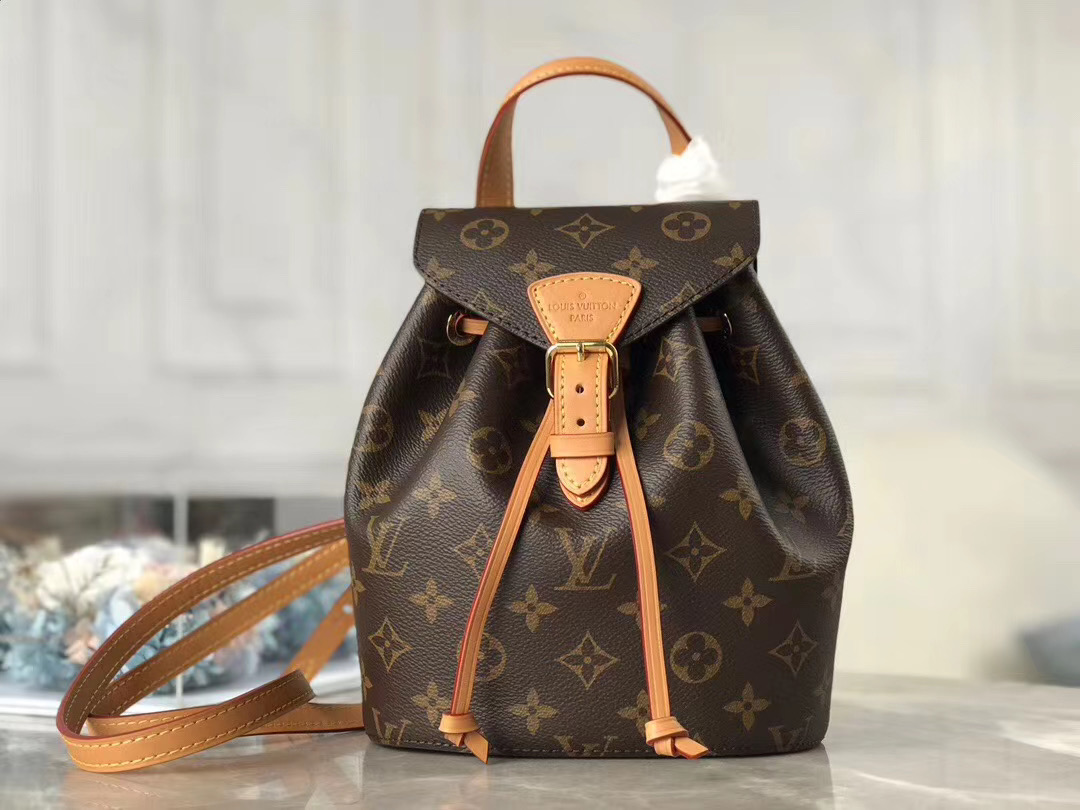 LOUIS VUITTON Montsouris Backpack. Original Quality Bag including gift box, care book, dust bag, authenticity card. This is an elegant new backpack made from Monogram canvas and cowhide leather, it closes with an archive Louis Vuitton buckle and leather drawstrings. Practical, with a roomy interior, it features an outside zipped pocket. The top handle and adjustable leather straps allow multiple carry options.