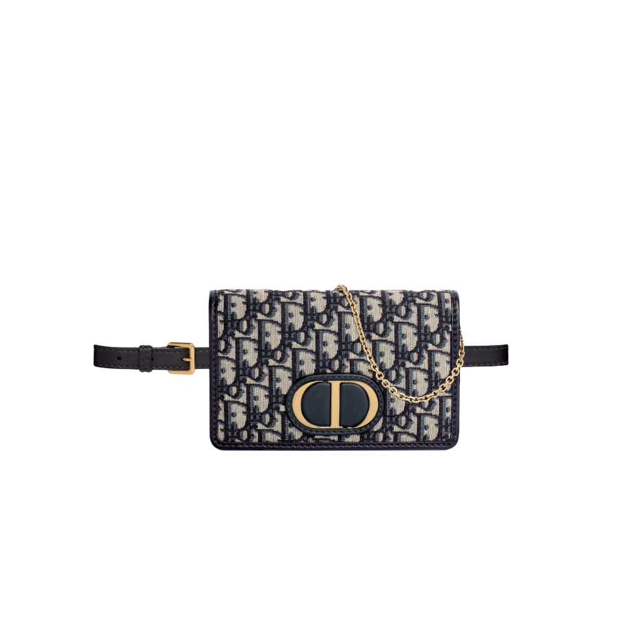 DIOR 30 Montaigne 2-in-1 Pouch. Original Quality Pouch including gift box, care book, dust bag, authenticity card. This pouch depicts a versatile design that features a 'CD' element at the front to capture the signature look of the 30 Montaigne line. A single interior compartment is accented by 4 card slots, 1 zip pocket, and 2 patch pockets. The piece can be worn as a belt, over the shoulder, crossbody, or carried as a clutch.