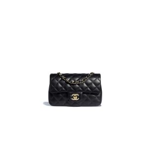 CHANEL Classic New Mini 20 cm Flap Bag. Original Quality Bag including gift box, care book, dust bag, authenticity card. This chic petite shoulder bag is crafted of luxurious shimmery lambskin leather. The crossbody bag features a long chain-link leather threaded shoulder strap and front flap with a CC turn lock. The flap opens to an interior of matching leather with zipper and patch pockets. Enjoy this fabulous bag for everyday essentials or special events with this timeless classic.