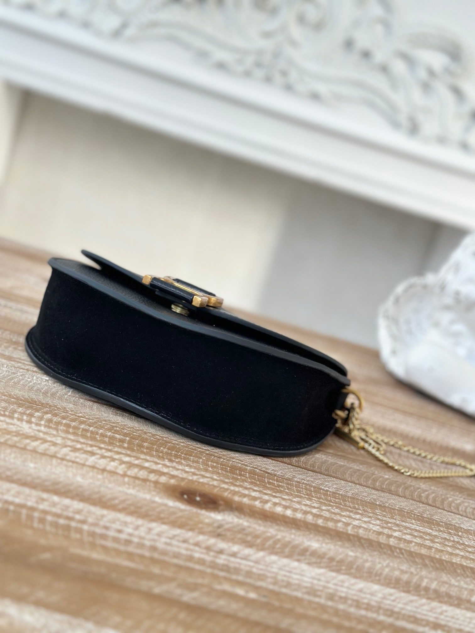 Marcie Chain Flap Bag. Authentic quality luxury bag crafted in genuine leather comes with authenticity card, dust bag and gift bag. Elevating Iconic Elegance: Marcie Line Redefined. Experience a fresh take on *loé's iconic Marcie line with this exquisite chain flap bag, meticulously crafted from a captivating blend of nappa lambskin, grained calfskin, and sumptuous suede. The line's signature hardware undergoes a graceful transformation, now adorned with *loé's engraved jewelry hallmark, adorning the flap with sophistication. An intricately hand-braided top handle pays homage to another hallmark Marcie feature, while a gracefully extended chain strap adds a refined touch. Whether you choose to drape it over your shoulder or wear it cross-body during the day, or opt to detach the strap and carry it by hand for a sophisticated evening ensemble, this flap bag is a versatile masterpiece. *loé's Marcie bag line effortlessly melds a feminine aesthetic with the free-spirited vibe of the '70s. An equestrian-inspired allure takes center stage, elevated by the allure of gleaming gold-toned hardware, resulting in a distinctly feminine yet timelessly chic look.