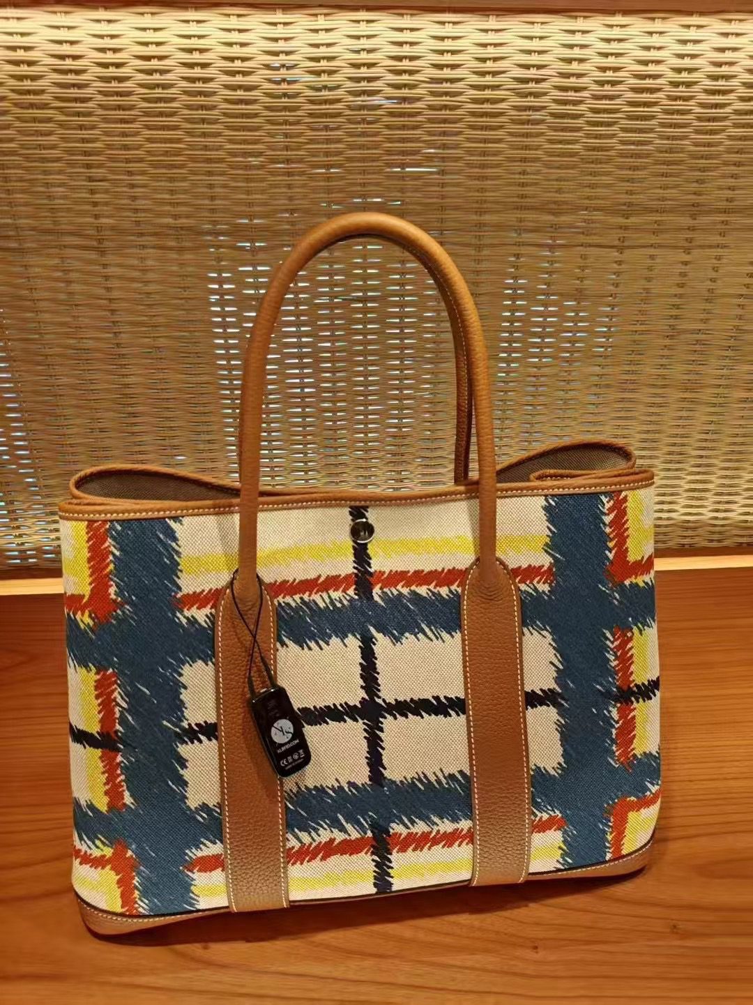 Garden Party Voyage. Authentic quality luxury bag crafted in genuine leather comes with authenticity card, dust bag and gift bag. The Art of Everyday Escape. Chic, structured, and effortlessly refined, the *RMÈS Garden Party Voyage is the perfect companion for your daily adventures or spontaneous weekend getaways. Crafted with precision in supple Negonda leather or canvas with leather trim, this midsize tote strikes the perfect balance between luxury and functionality. Its minimalist silhouette is elevated by discreet Clou de Selle snap closures and expandable sides, offering both form and flexibility. Spacious enough for your essentials yet compact enough to carry with ease, it’s a timeless piece designed to move with you—gracefully. Whether carried in hand or worn over the shoulder, the Garden Party Voyage 36 speaks in whispers of elegance and unmistakable *RMÈS craftsmanship. Every day is a journey. Travel beautifully.