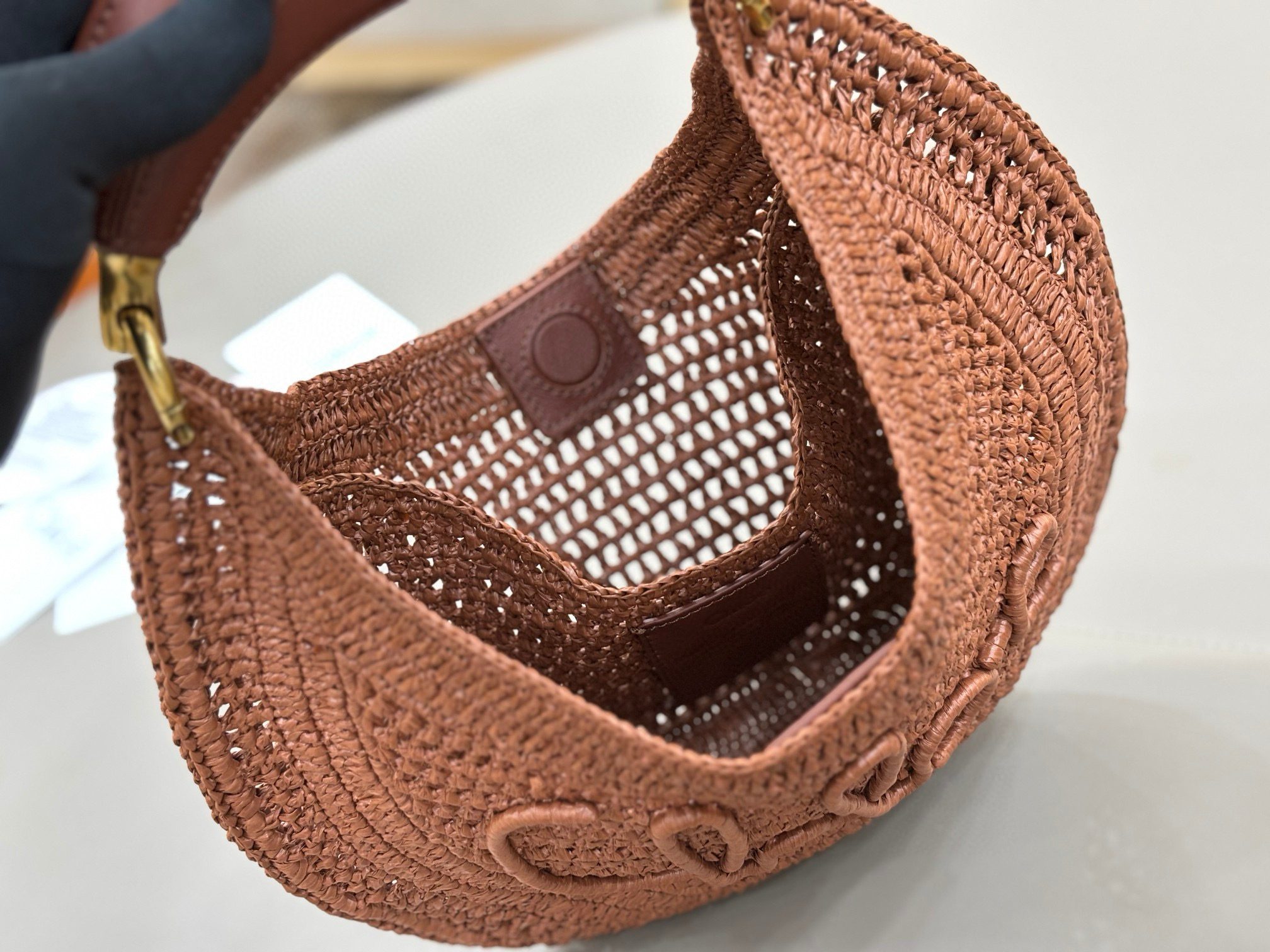 Summer Banana Hobo. Authentic quality luxury bag crafted in genuine leather comes with authenticity card, dust bag and gift bag. Artisanal Spirit, Curved in Style. Say hello to sunshine in bag form. The *LOÉ Summer Banana Hobo Bag is a joyful blend of craftsmanship and creativity, handwoven over four days by a single artisan in collaboration with Made For A Woman. This is not just a bag—it’s a story stitched in raffia and trimmed in luxurious calfskin. Its curved, banana-inspired silhouette hugs the shoulder with ease, while the sculptural handle and handwritten signature nod to *loé’s heritage of effortless elegance. Light, natural, and undeniably chic, it's the perfect companion for sun-soaked escapes or city strolls with a coastal state of mind. A celebration of craftsmanship, femininity, and the art of slow fashion.