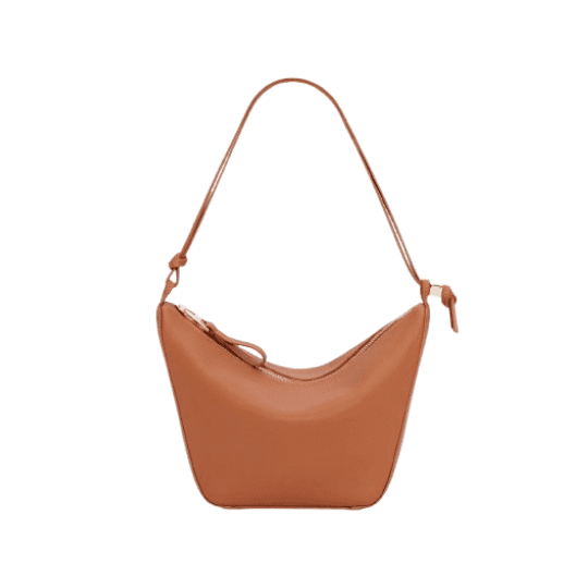 The Mini Hammock Hobo is a contemporary reimagining of *oewe’s iconic Hammock bag. This streamlined variation offers a sleek, sculptural silhouette designed as a versatile sling bag for modern living. Expertly crafted in classic calfskin, it features soft, supple leather and a compact form that adapts effortlessly to your day. The unique design allows for multiple carry options—wear it crossbody, over the shoulder, or by hand. Elegant yet functional, this mini hobo is perfect for essentials, making it an ideal choice for both daily wear and minimalist style statements.