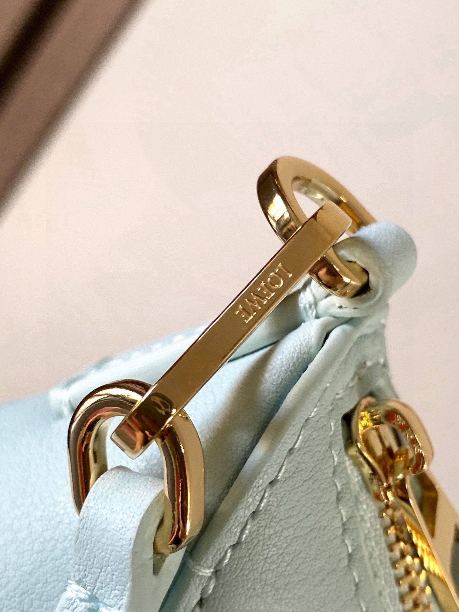 Puzzle Fold Pouch. Authentic quality luxury bag crafted in genuine leather comes with authenticity card, dust bag and gift bag. Sculpted Sophistication — The Art of Function. The Puzzle Fold Pouch redefines modern elegance with its sculptural geometry and effortless versatility. Crafted in luxurious shiny nappa calfskin, its signature folded panels create a dynamic, architectural silhouette that’s instantly recognizable. Both stylish and practical, this pouch transitions seamlessly from day to night—perfect for carrying essentials with a touch of *OEWE sophistication. A masterpiece of craftsmanship, it’s the ultimate blend of innovation and timeless design.